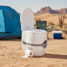 white portable toilet at a desert campsite
